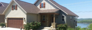 home on lake gets updated siding Seamless Experts residential and commercial exterior remodeling Ozarks Missouri