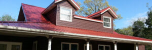 home with new red roof Seamless Experts residential and commercial exterior remodeling Ozarks Missouri